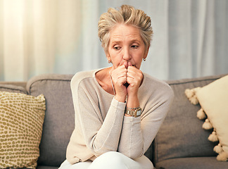 Image showing Anxiety, depression and elderly woman on sofa thinking, worry and suffering memory loss in living room. Sad, confused and senior woman on couch afraid, phobia and suffer from alzheimers or dementia