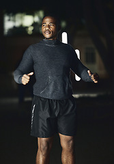 Image showing Fitness, night or black man ready for running exercise, cardio training or late workout in a dark city in Nigeria. Start, mindset or healthy athlete runner thinking of sports goals, mission or vision