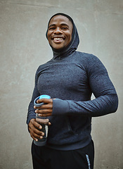 Image showing Black man runner, happy and portrait by wall, city and water bottle for health, fitness or wellness. Urban man, smile and happiness for running, training or workout in metro with self care in Chicago