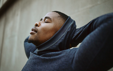 Image showing Black man, relax and tired for training, workout and outdoor exercise, fitness and wellness. African American male, runner and athlete balance, closed eyes and peace after running, health and rest.