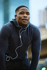 Image showing Breathe, black man and fitness break for city workout, wellness exercise and running outdoors. Runner, breathing and relax after cardio marathon with music earphones for motivation, mindset and goals