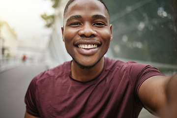 Image showing Fitness, portrait or black man taking a selfie in a city for social media marketing online content or running exercise blog. Face, pictures or happy African runner smiles with pride or freedom