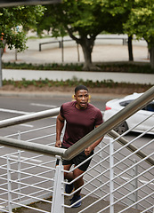Image showing Black man, fitness and running on city stairs in cardiovascular workout, healthcare exercise or morning wellness training. Runner, sports athlete and personal trainer on steps for body muscle growth