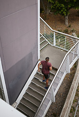 Image showing Runner, staircase and outdoor workout for fitness, sports wellness or running exercise. Building stairs, marathon training run in morning and healthy athlete person fon cardio performance motivation