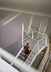 Image showing Running, fitness and top view of black man on stairs for health, wellness and exercise. Sports, training and male runner jog, exercising or cardio workout on steps outdoors for strength and endurance