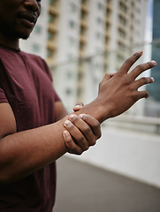 Image showing Black man, wrist pain and medical accident outdoor for fitness wellness or exercise workout. Hand emergency, carpal tunnel and African man with arm injury or arthritis for sports training in city