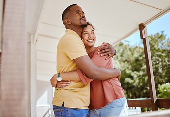 Image showing Black couple, bonding and love hug in house or home patio as new property owners, mortgage investment success or real estate buyers. Smile, happy and embrace man and woman with future security goals