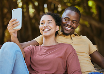 Image showing Black couple, phone and selfie with smile at outdoor nature park for travel, happiness and social media profile picture content update. Happy man and woman with 5g network connection on vacation date