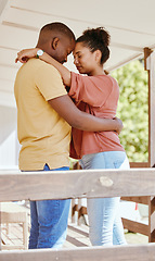 Image showing Black couple, love and hug while outdoor on patio at. home while together for trust, support and care in a healthy marriage. Man and woman with gratitude, commitment and happiness while on holiday