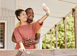 Image showing Love, phone selfie and black couple in home by balcony, bonding and having fun. Romance, hug and man and woman taking pictures on mobile smartphone for happy memory, social media or profile picture.