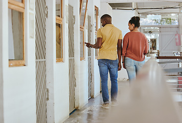 Image showing Animal shelter, adoption and charity with a black couple together in a rescue center for community aid. Help volunteer and ngo with a man and woman walking through a kennel for pet adoption