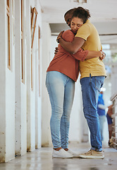 Image showing Hug, animal shelter and adoption with a black couple together in a rescue center for foster care. Hugging, volunteer and charity with a man and woman doing charity or relief work while bonding