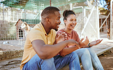 Image showing Adoption, animal shelter and love with a black couple together outoor, sitting at a rescue center for welfare. Happy, smile and charity with a man and woman looking to foster a pet dog or puppy