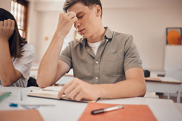 Image showing Stress, headache and student in classroom with anxiety, mental health risk and burnout for study, education and learning problem. Tired, fatigue and depression of teenager in school or college desk