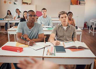 Image showing High school, students and boys listening in classroom of education, learning or knowledge. Highschool, studying and attention to teacher, academic lecture and teaching group for young people together