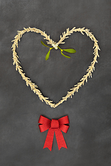 Image showing Christmas Symbols Heart Shape Wreath Bow and Mistletoe