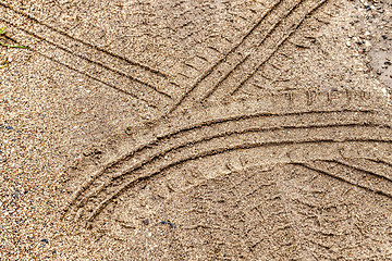 Image showing car tire tracks on a sandy road