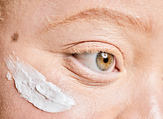 Image showing Beauty, albino and woman closeup with sunscreen, product and spf treatment, cosmetics and protection. Skincare, girl and eye, face and facial cream on albinism model for wellness, collagen and skin