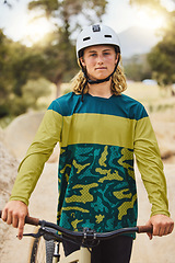 Image showing Mountain bike, portrait and man in nature or park for outdoor training, sports competition or fitness goals in Canada with youth lifestyle. Athlete cycling with bicycle and safety helmet for exercise