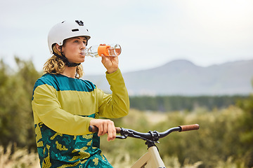 Image showing Wellness, nature and bike man drinking water for healthy lifestyle and fitness in Vancouver, Canada. Journey, adventure and cycling person with water bottle for cardio exercise hydration break.