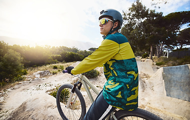 Image showing Mountain bike, forest and sports man in gear for outdoor travel, journey or performance training with challenge, focus and vision. Bicycle, nature and cycling athlete thinking of competition goals