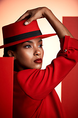 Image showing Beauty, fashion and aesthetic woman in red suit for cosmetics, makeup and designer brand clothes advertising while thinking about color. Face of strong 90s retro model in studio for empowerment