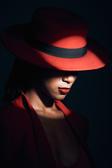 Image showing Fashion, red suit and woman in the dark for vintage clothes, retro and mafia aesthetic on a black studio background. Designer, mysterious and face of an elegant model with classy and fancy style