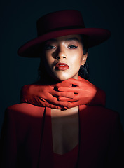 Image showing Beauty, makeup and fashion of a black woman in dark studio with spotlight on face for cosmetics, designer brand clothes and art deco. Portrait of London model with red lipstick and hand glove on neck