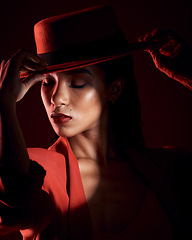 Image showing Vintage, dark fashion and mysterious woman with a shadow, luxury makeup and designer on a black studio background. 90s, cosmetics and face of a model with vintage and retro clothes for mystery