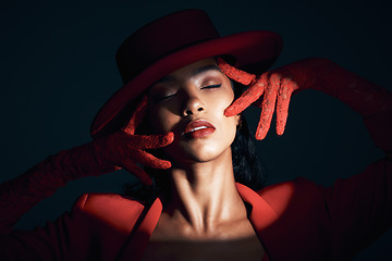 Image showing Fashion, beauty and spotlight on face of woman in dark background studio makeup, cosmetics and style. Creative art, red aesthetic and girl pose with vintage, luxury outfit and designer accessories