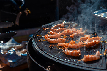 Image showing A professional cook prepares shrimps