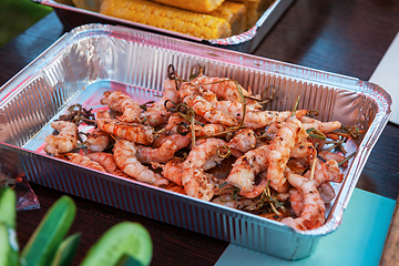 Image showing A professional cook prepares shrimps