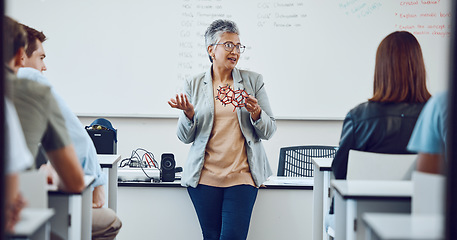 Image showing Education, university professor and students in classroom for lecture on innovation in science, physics or math. Focus, attention and woman college teacher in presentation with diversity in learning.