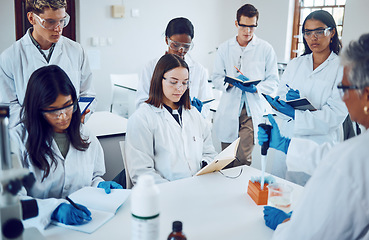 Image showing Science, students and education in a medical laboratory writing notes during scientist lecture or lesson with mentor or teacher. Medical men and women for training and learning in chemistry class