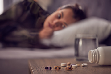 Image showing Depression, anxiety and medicine with a suicide woman lying on her bed in the bedroom of her home alone. Mental health, help and pills with a female suffering from a psychology disorder in her home