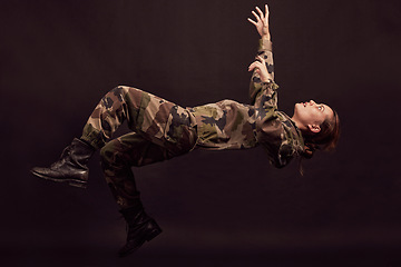 Image showing Anxiety, soldier and woman in studio for war ptsd, nightmare and horror, mental health and depression on black background. Military, flashback and girl in army crisis, trauma and fall Ukraine veteran