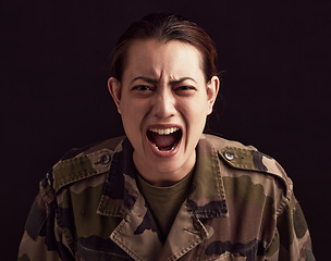 Image showing Trauma, scream and woman soldier with ptsd, military depression and mental health problem on black background of Ukraine war. Horror, anxiety and portrait of scared female army veteran shout in fear