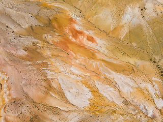 Image showing Aerial shot of the textured yellow nad red mountains resembling the surface of Mars