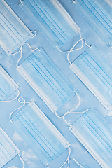 Image showing Medical masks on the blue colored background