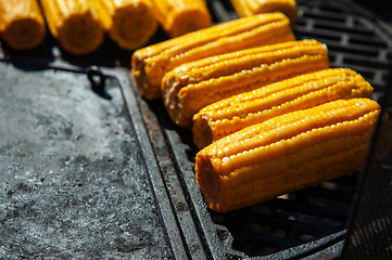 Image showing A professional cook prepares corn