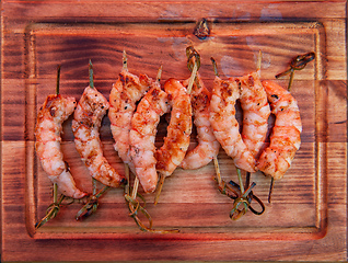 Image showing A professional cook prepares shrimps