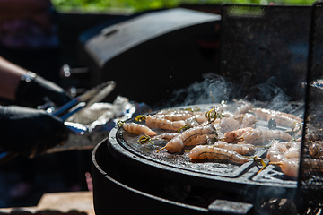 Image showing A professional cook prepares shrimps