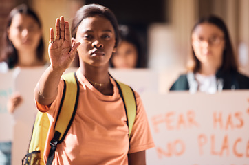 Image showing Hand, stop or black woman at a student protest for free public education, government funding or human rights. Girl, school or crowd of angry students fighting for a change, gender equality or justice