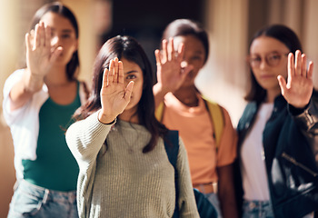 Image showing Woman, student and hands in stop for protest, enough or team standing for human rights or women empowerment. Group of female students with raised hand in halt, unity or strike for safe education