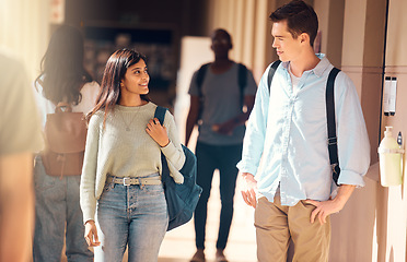 Image showing Students, man or woman walking in hallway of school, university or college campus for education, global learning or study bonding. Smile, happy or scholarship friends talking and future success goals
