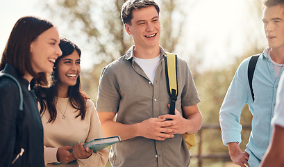 Image showing Group of friends, students and conversation outdoor, relax and happy together. Young people, standing in circle and talking on campus, bonding and enjoy break in nature, discussion for test and laugh