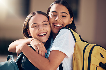 Image showing Girls, bonding and fun hug on school, college or university campus for social gathering, exam pass celebration or congratulation success. Smile, happy friends and laughing students in embrace support