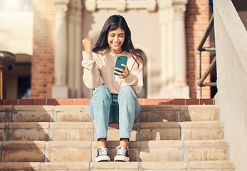 Image showing happy celebration, stairs and woman with phone celebrate online shopping app, fashion deal or ecommerce sales. Discount voucher winner, retail e commerce or customer fist pump for success achievement