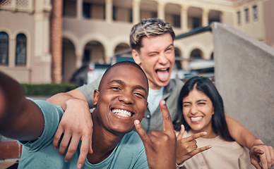 Image showing Friends selfie, smile and portrait on university campus with diversity, happy and funny face, hand gesture and rock sign. Happy, portrait and interracial college friendship, students and photograph