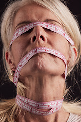 Image showing Face, tape measure and woman with anorexia, eating disorder and pain from society body pressure, mental health problem or bulimia. Measuring tape on lady with unhealthy weightloss, problem or anxiety